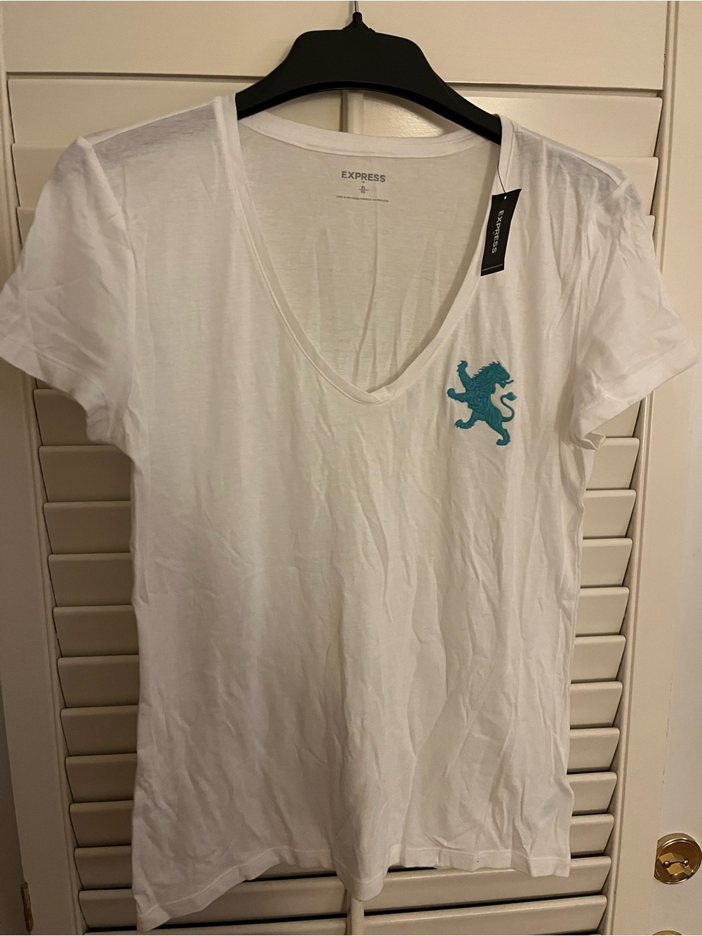 Express white v-neck tee with teal lion crest